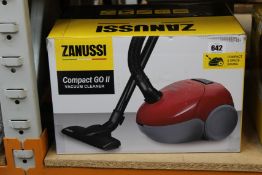 A new Zanussi Compact Go ll Red, 750W, 1.5L, 5M automatic cord rewind vacuum cleaner.
