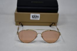 A pair of as new Burberry sunglasses.