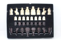 An as new The Lewis Chessmen chess set by National Museums Scotland.