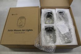 Eight boxes of OxyLED solar mason jar lights (Four jars per box).