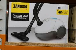 A new Zanussi Compact Go ll White, 750W, 1.5L, 5M automatic cord rewind vacuum cleaner.