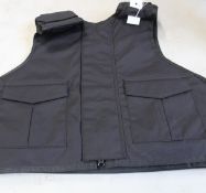A Safe Guard Armour Patrol 1 tactical armour vest in Black, with a detachable 'Public Safety' Velcro