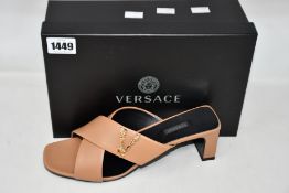 A pair of as new Versace sandals in beige (IT 41 - RRP £560).