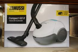 A new Zanussi Compact Go ll White, 750W, 1.5L, 5M automatic cord rewind vacuum cleaner.