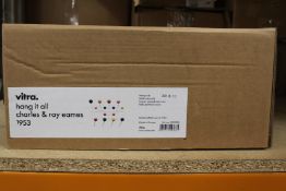 A Vitra Charles and Ray Eames Hang It All multi coloured coat rack.