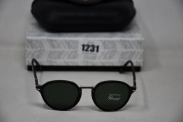 A pair of as new Persol Caligrapher Edition PO3184S sunglasses.