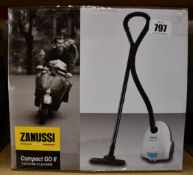 A new Zanussi Compact Go ll White, 750W, 1.5L, 5M automatic cord rewind vacuum cleaner.