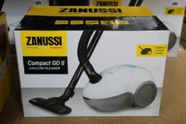 A new Zanussi Compact Go ll White, 750W, 1.5L, 5M automatic cord rewind vacuum cleaner.