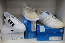 Three pairs of as new Adidas trainers; women's Superstar Bold (UK 6), Superstar (UK 10) and
