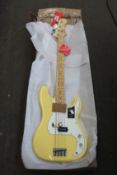 A Fender Player Series Precision Bass in Buttercream.