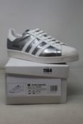 A pair of as new Prada Adidas Superstar sneakers (UK 11).