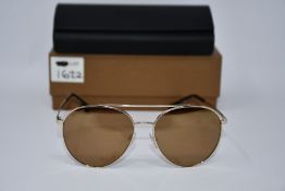 A pair of as new Burberry sunglasses.