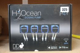 A boxed as new H2Ocean dosing pump P4 for supplement control for aquariums.
