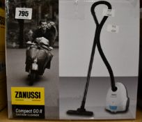 A new Zanussi Compact Go ll White, 750W, 1.5L, 5M automatic cord rewind vacuum cleaner.