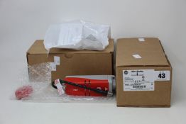 Two Allen-Bradley GuardMaster Solenoid interlock switches (440G-LZS21SPLH).