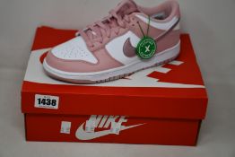 A pair of youths as new Nike Dunk Low GS with authentication tag (UK 5.5).