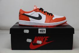 A pair of as new Nike Air Jordan 1 Low (UK 8).