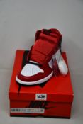 A pair of women's as new Nike Air Jordan 1 High OG (UK 7).