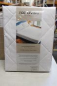 Ten packs of The Bedding Co. Top Living Premium mattress protectors (King size).