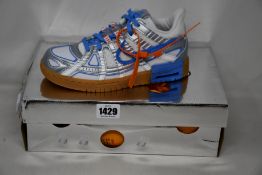 A pair of as new Nike Off White Rubber Dunk (UK 5).