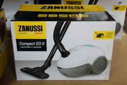 A new Zanussi Compact Go ll White, 750W, 1.5L, 5M automatic cord rewind vacuum cleaner.