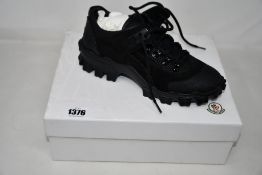 A pair of as new Moncler Henry shoes (TG 38.5).