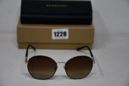 A pair of as new Burberry sunglasses.