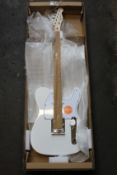 A Fender Squier Affinity Series Telecaster with Laurel Fingerboard in Olympic White.