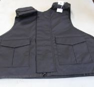 A Safe Guard Armour Patrol 1 tactical armour vest in Black, with a detachable 'Public Safety' Velcro