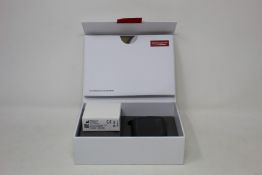 A RSound GN LiNX Quattro sound processing unit and case.