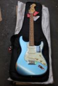 A Fender Vintera Road Worn 60s Stratocaster in Lake Placid Blue.