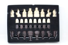 An as new The Lewis Chessmen chess set by National Museums Scotland.