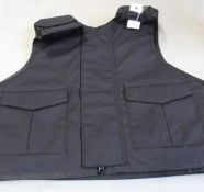 A Safe Guard Armour Patrol 1 tactical armour vest in Black, with a detachable 'Public Safety' Velcro