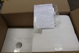 A Michael Anastassiades tip of the tongue wall mounted light.