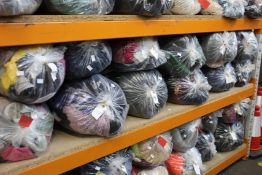 Twelve bags of pre-owned clothing and related items.