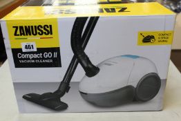 A new Zanussi Compact Go ll White, 750W, 1.5L, 5M automatic cord rewind vacuum cleaner.