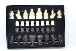 An as new The Lewis Chessmen chess set by National Museums Scotland.