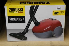 A new Zanussi Compact Go ll Red, 750W, 1.5L, 5M automatic cord rewind vacuum cleaner.