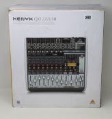 A Behringer Xenyx QX1222USB Premium 16-input analogue mixer.