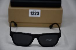 A pair of as new Burberry sunglasses.