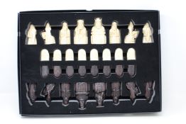 An as new The Lewis Chessmen chess set by National Museums Scotland.