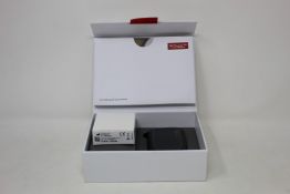 A RSound GN LiNX Quattro sound processing unit and case.