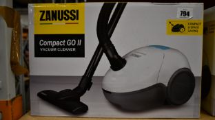 A new Zanussi Compact Go ll White, 750W, 1.5L, 5M automatic cord rewind vacuum cleaner.