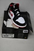 A pair of youths as new Nike Air Jordan 1 Mod (UK 4).