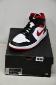 A pair of as new Nike Air Jordan 1 Mid (UK 9.5).