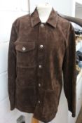 An as new Caruso brown suede jacket (TG 48).