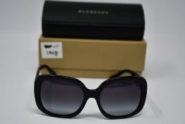 A pair of as new Burberry sunglasses.