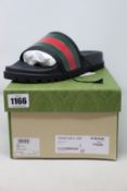 A pair of as new Gucci slides (UK 8).