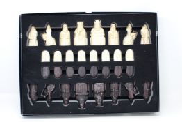 An as new The Lewis Chessmen chess set by National Museums Scotland.