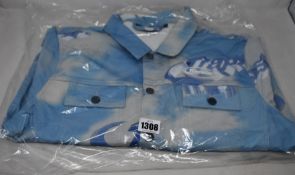 An as new Trapstar denim jacket with matching trousers (Both L).